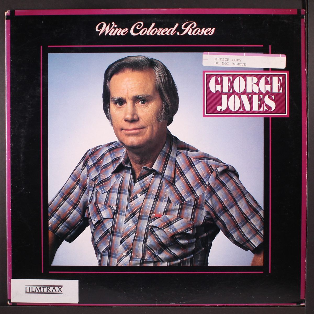 wine colored roses by GEORGE JONES
