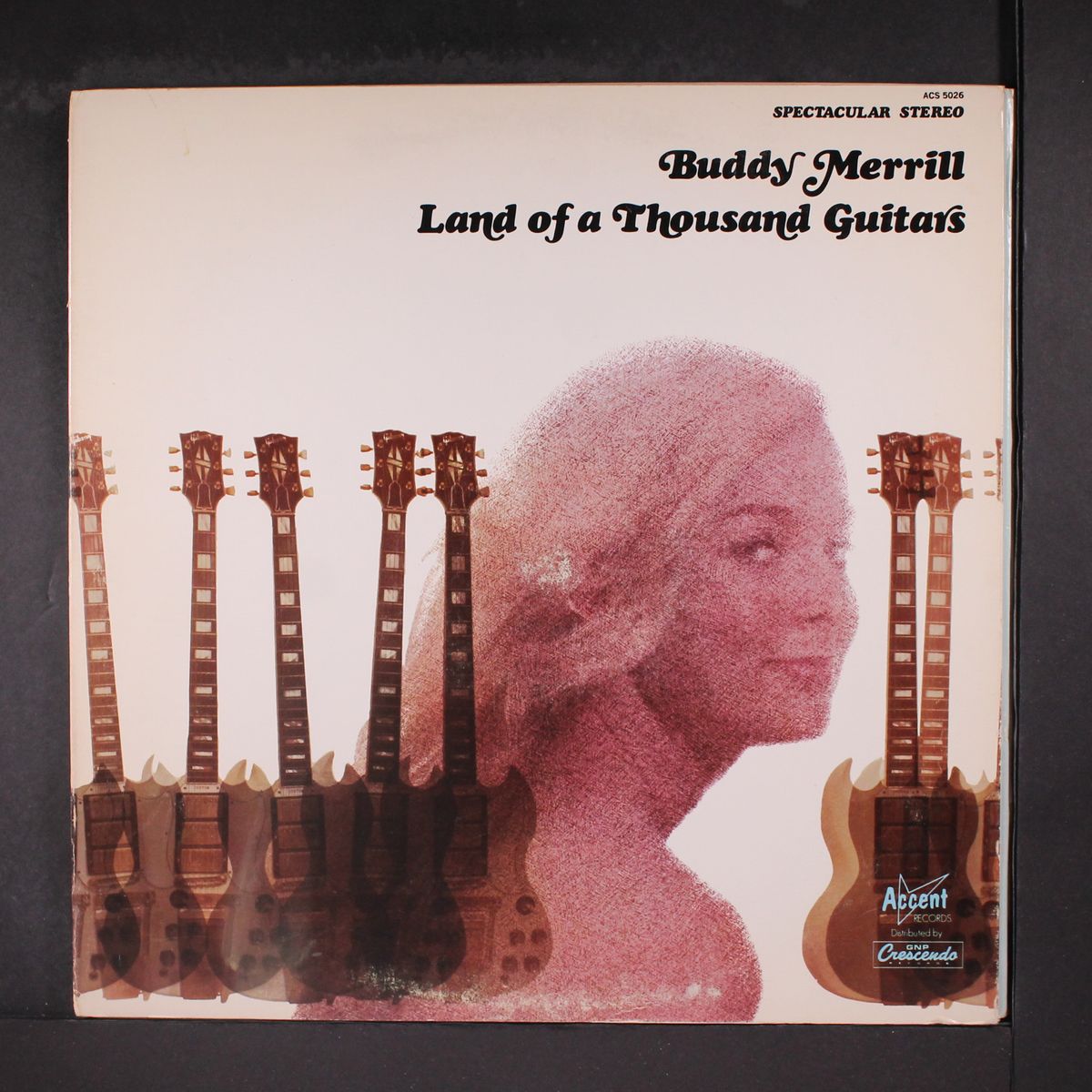 land of a thousand guitars by BUDDY MERRILL