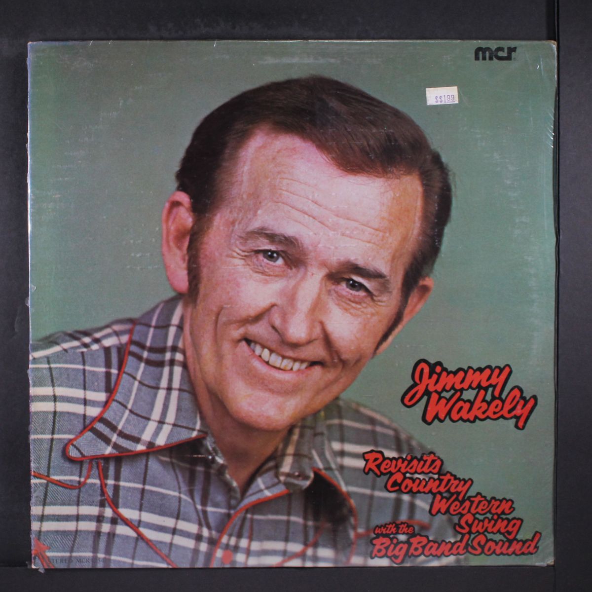 revisits country western swing with the big band sound by JIMMY WAKELY