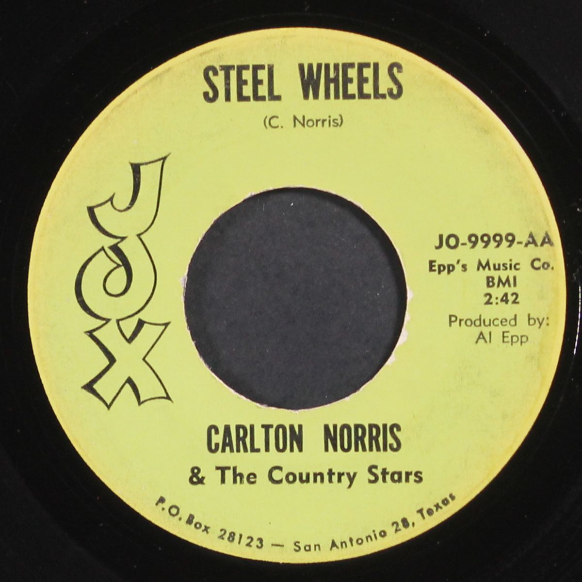 steel wheels / raining by CARLTON NORRIS