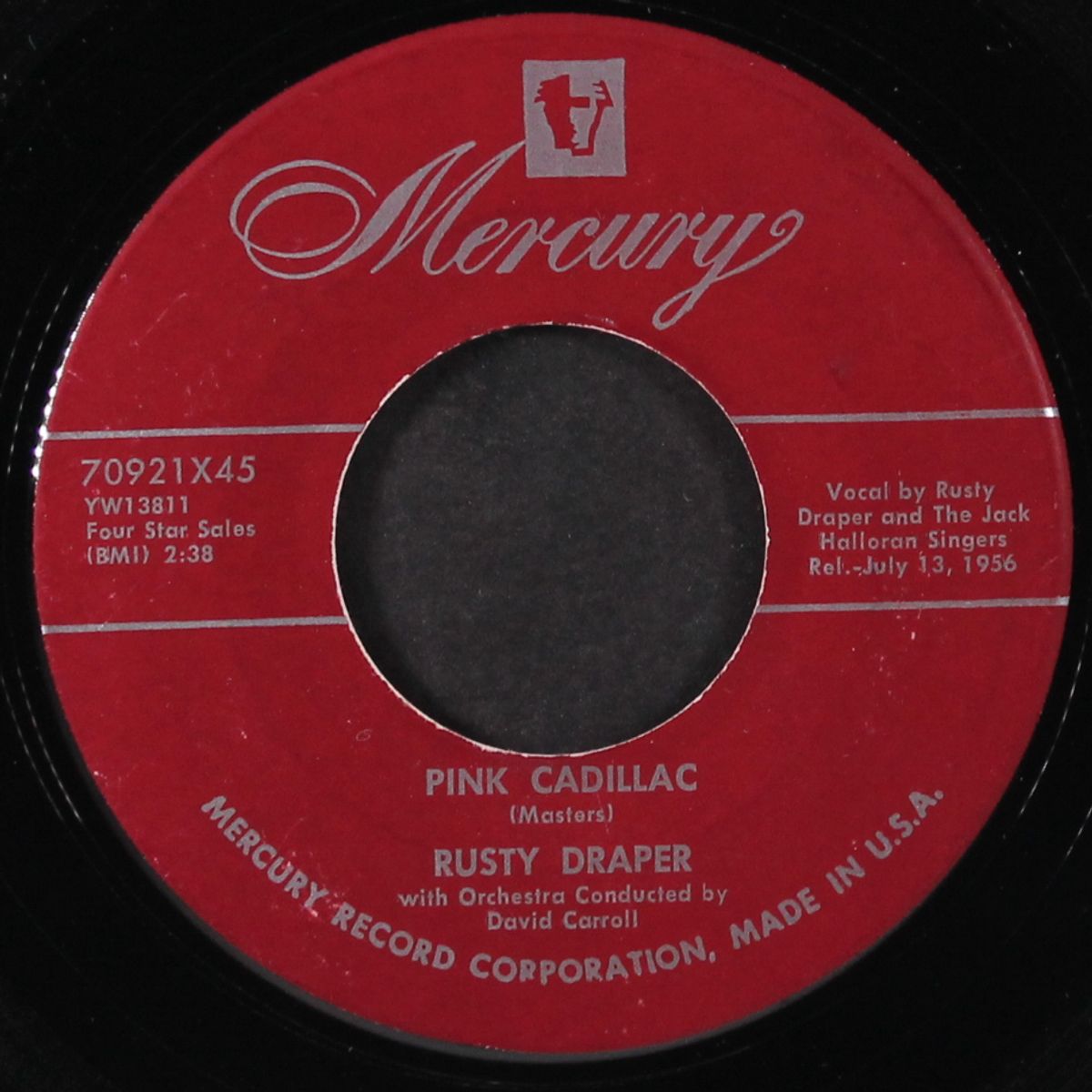 pink cadillac / in the middle of the house by RUSTY DRAPER