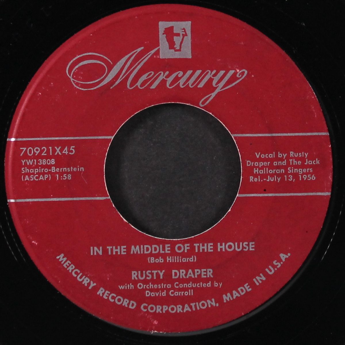 pink cadillac / in the middle of the house by RUSTY DRAPER