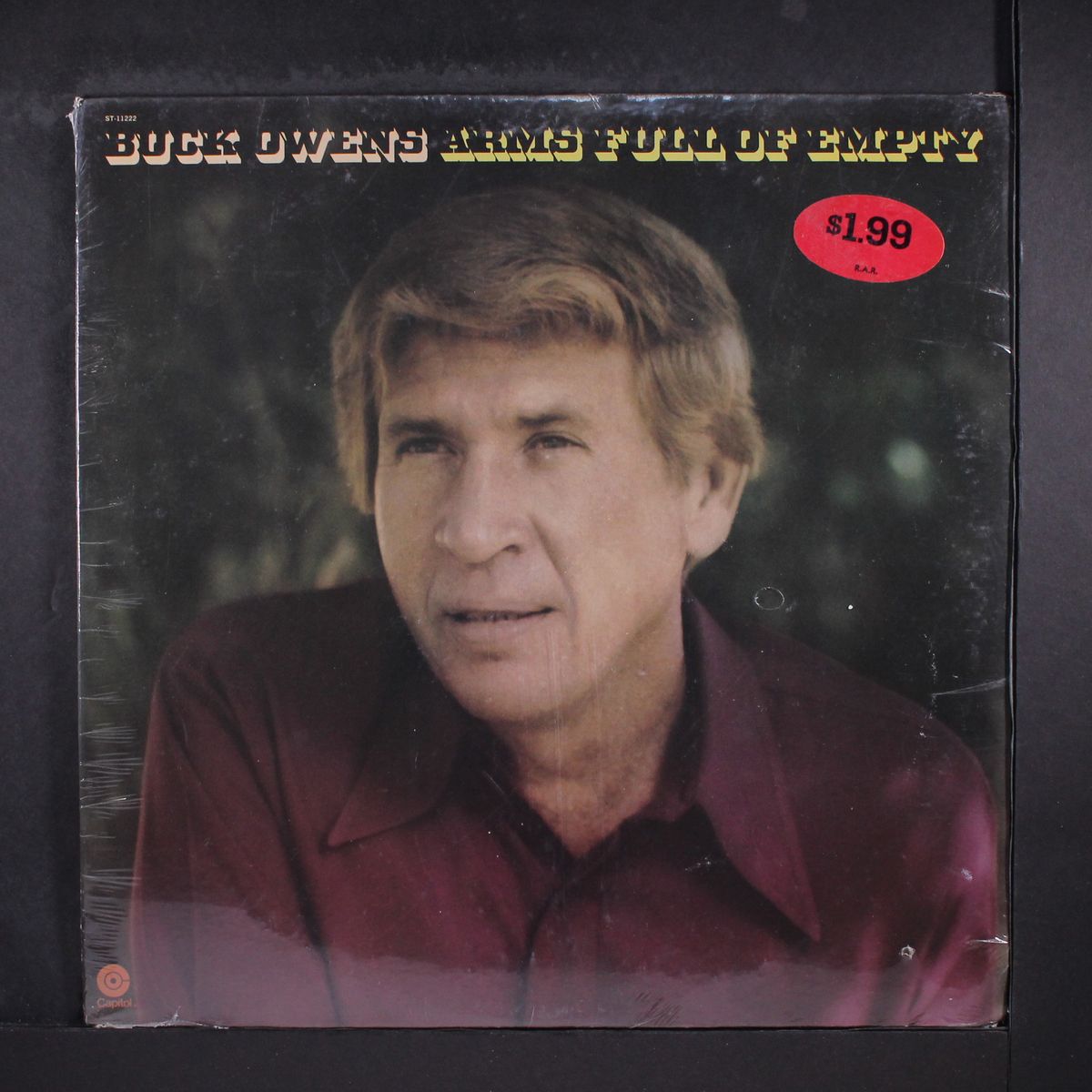 arms full of empty by BUCK OWENS
