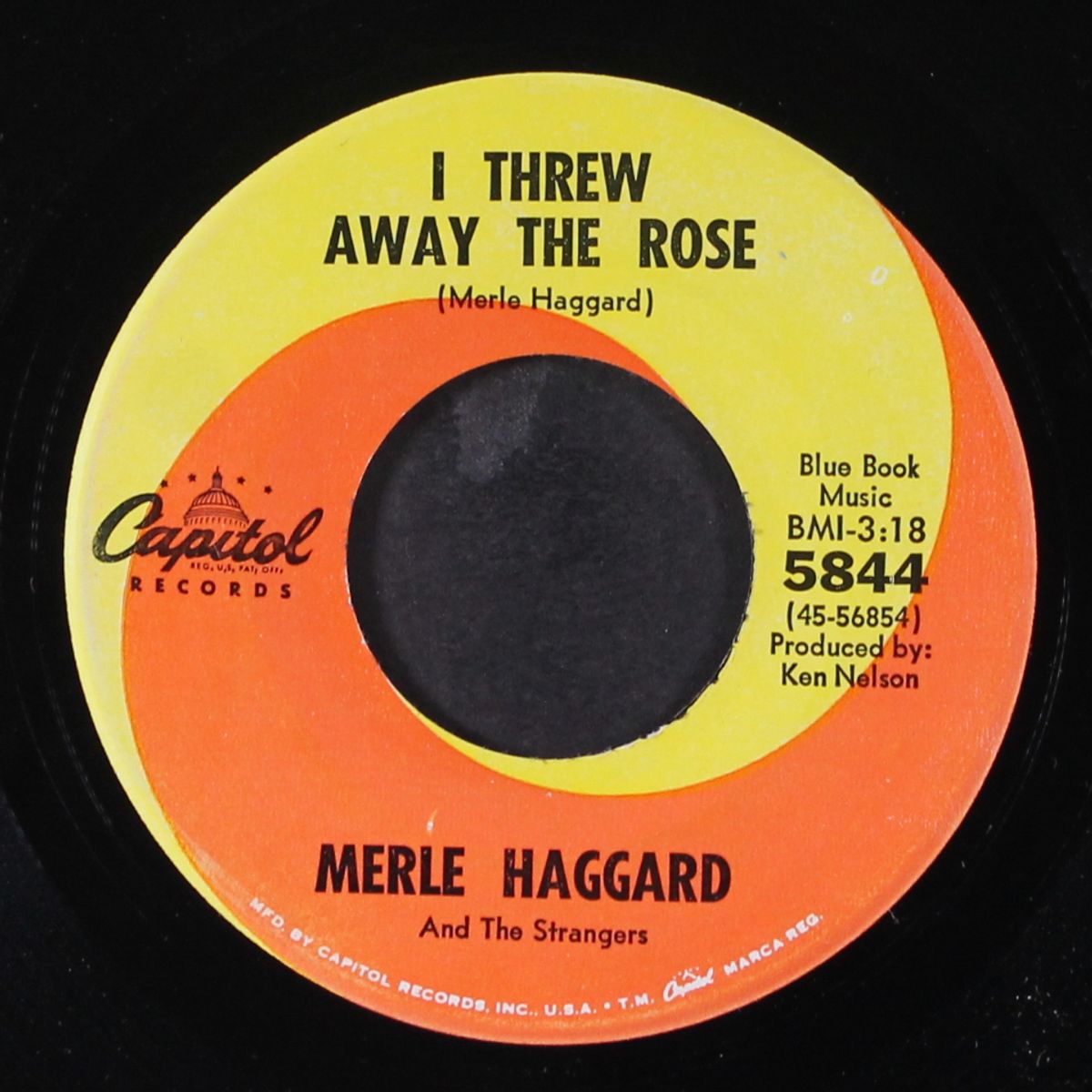 i threw away the rose / loneliness is eating me alive by MERLE HAGGARD