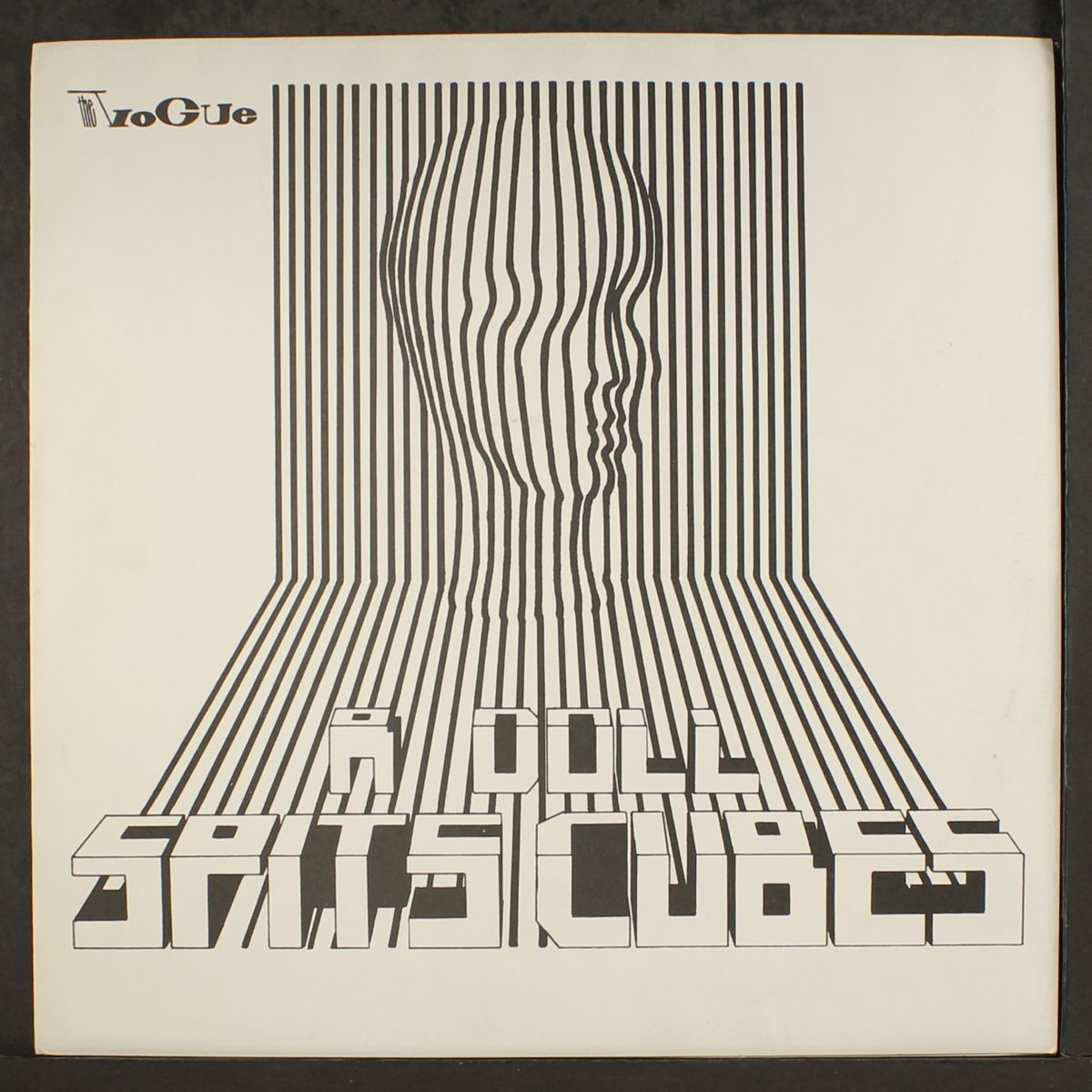 a doll spits cubes by VOGUE