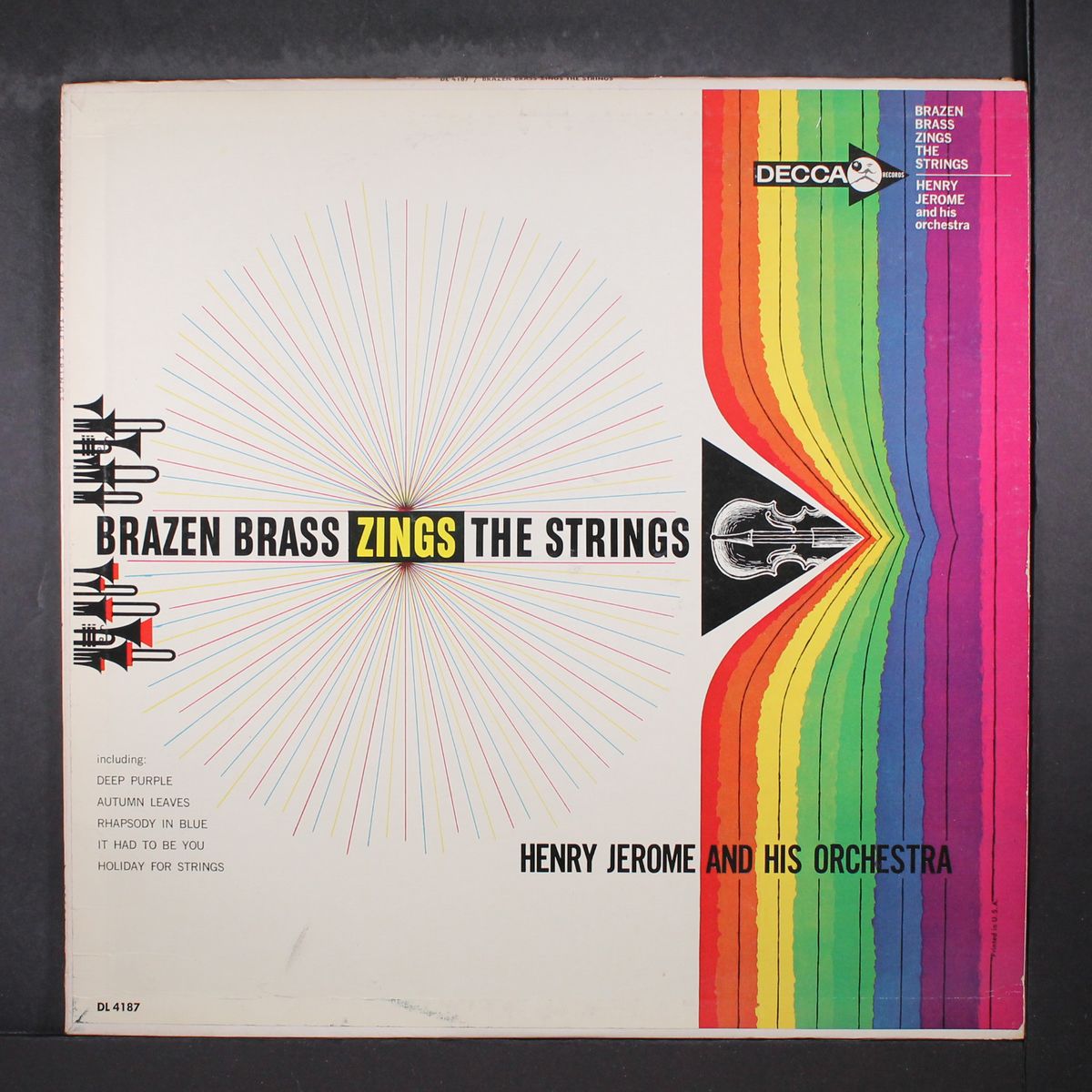 brazen brass zings the strings by HENRY JEROME