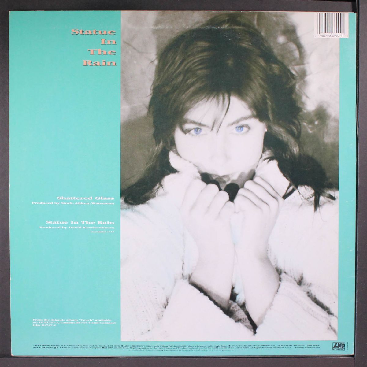 shattered glass / statue in the rain by LAURA BRANIGAN