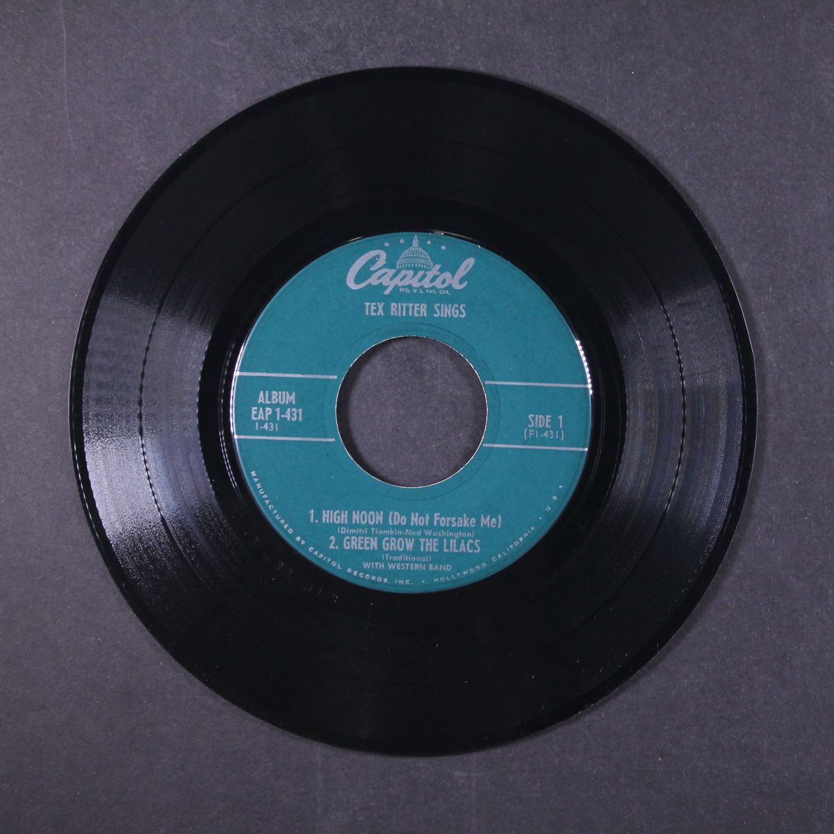 sings by TEX RITTER