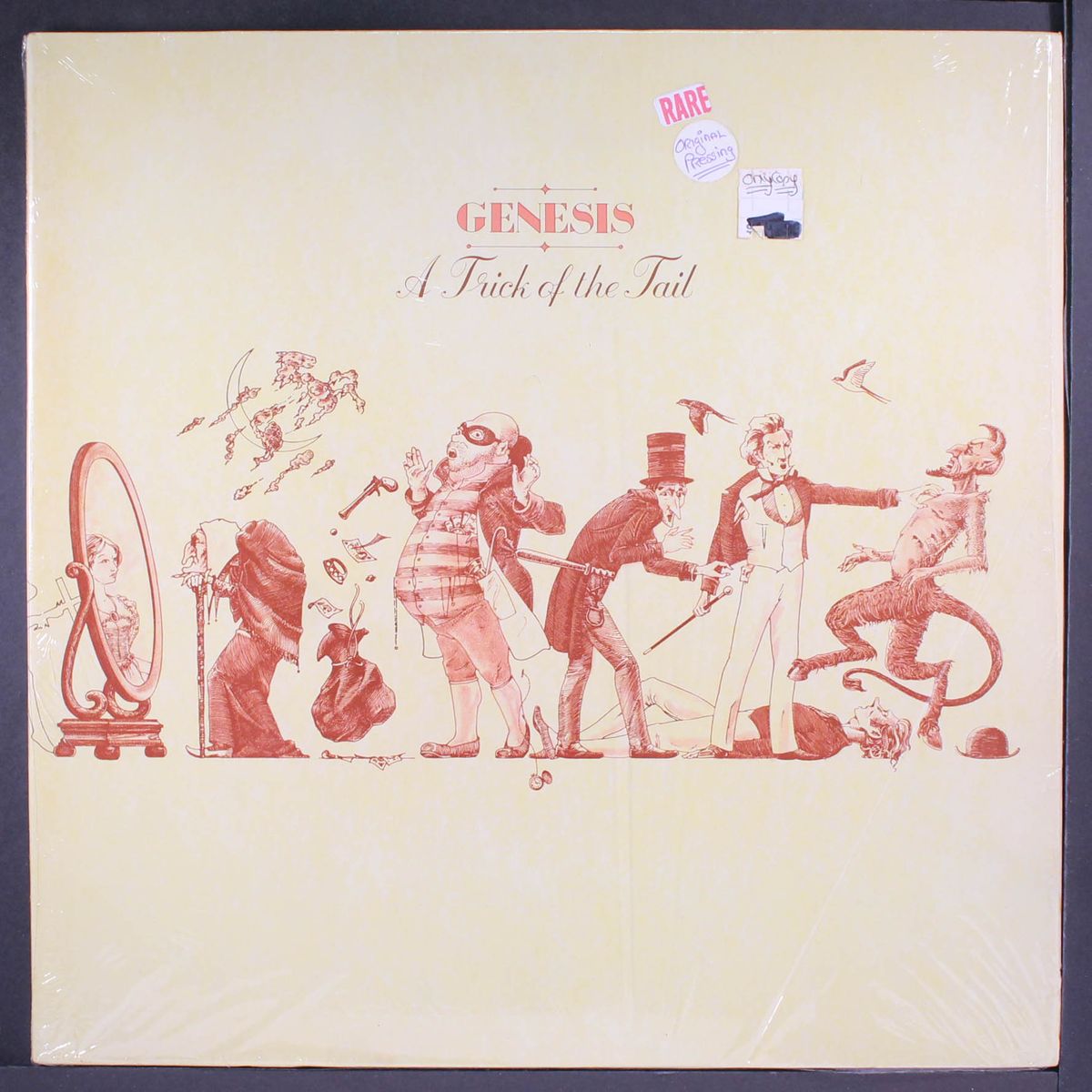 a trick of the tail by GENESIS