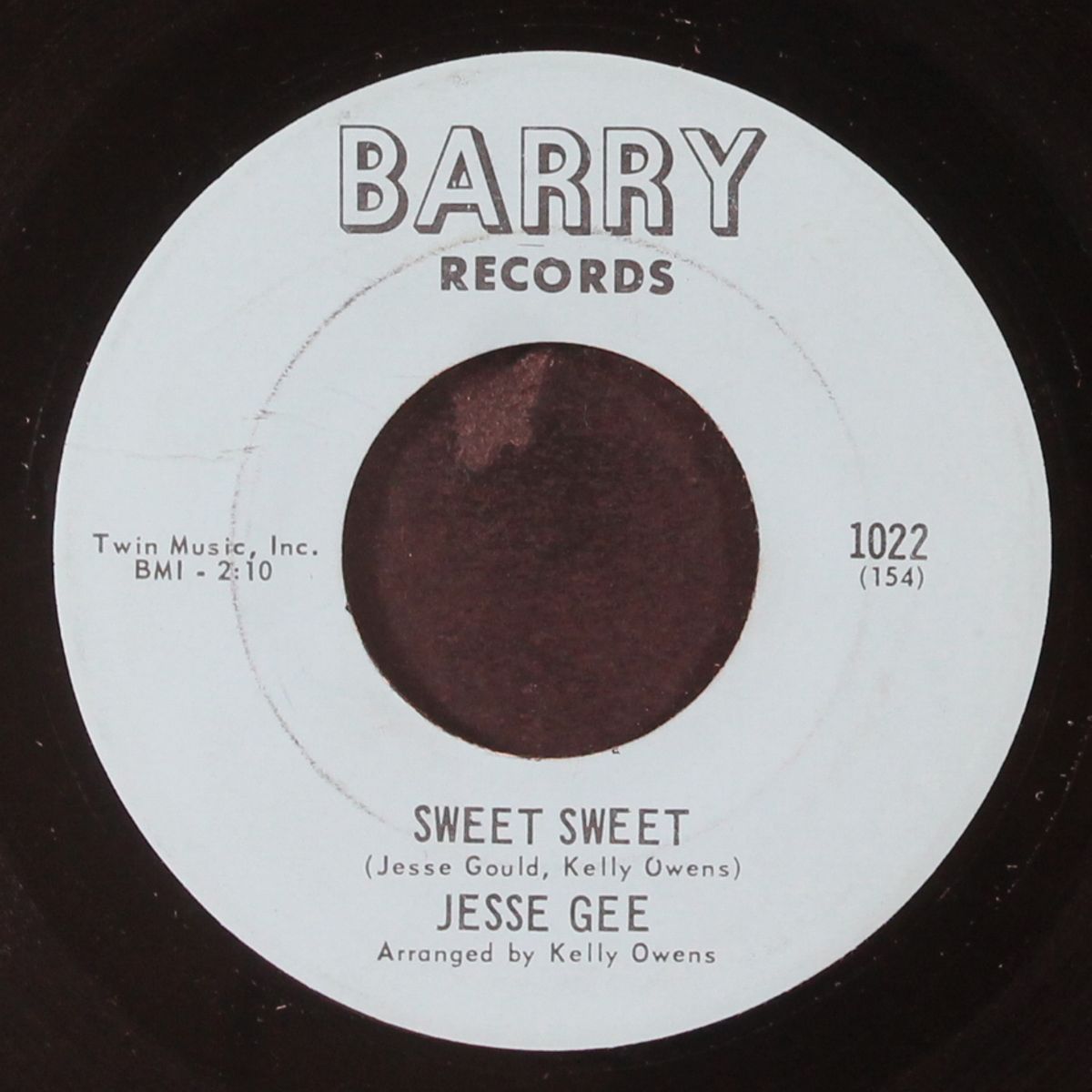 she's a woman / sweet sweet by JESSE GEE