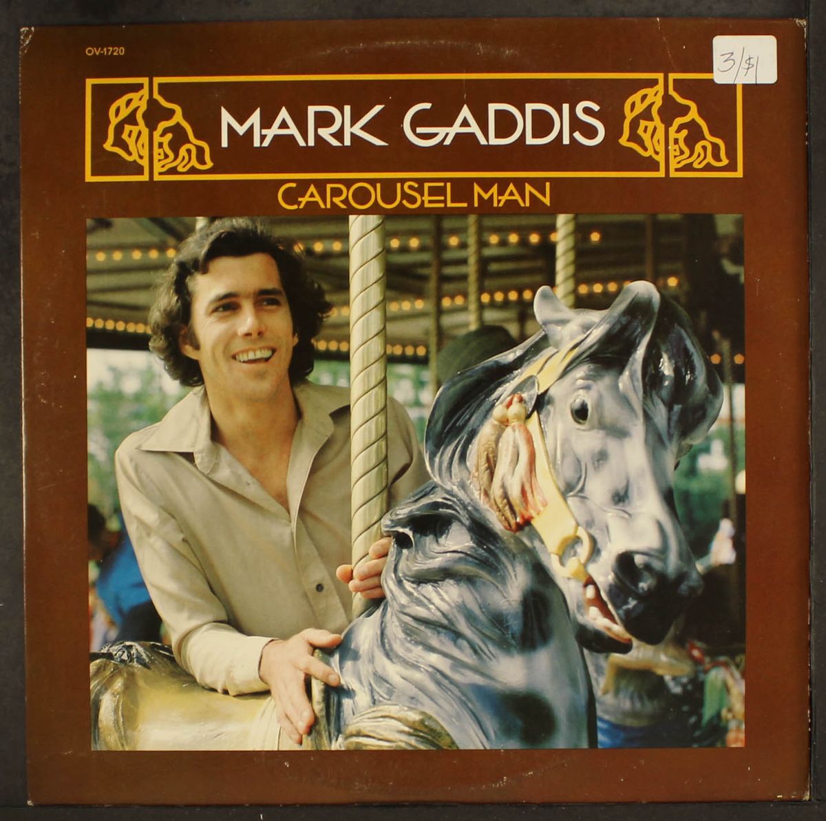 carousel man by MARK GADDIS