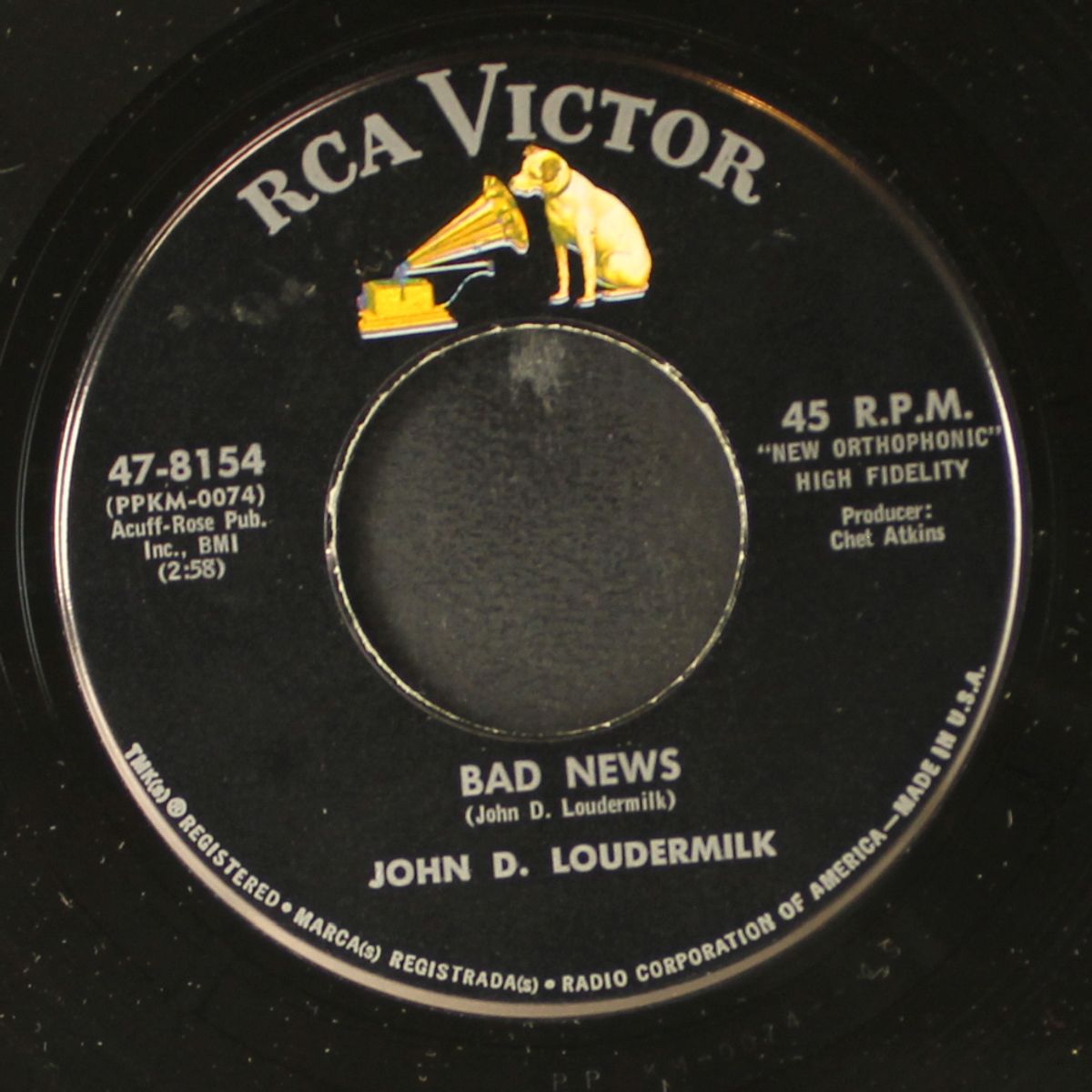 the guitar player / bad news by JOHN D. LOUDERMILK