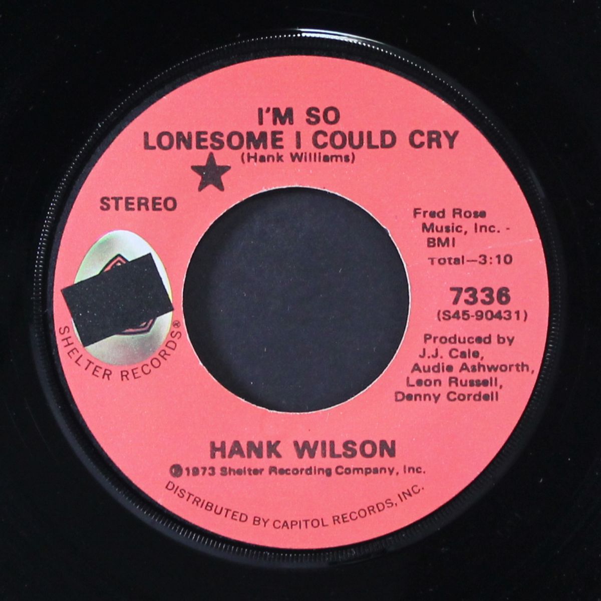 roll in my sweet baby's arms / i'm so lonesome i could cry by HANK WILSON