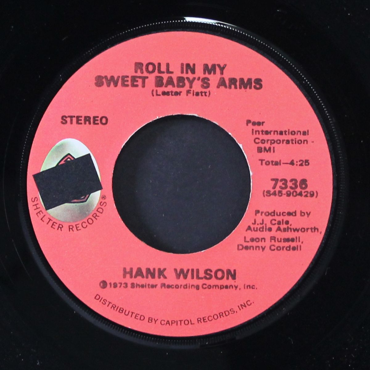 roll in my sweet baby's arms / i'm so lonesome i could cry by HANK WILSON