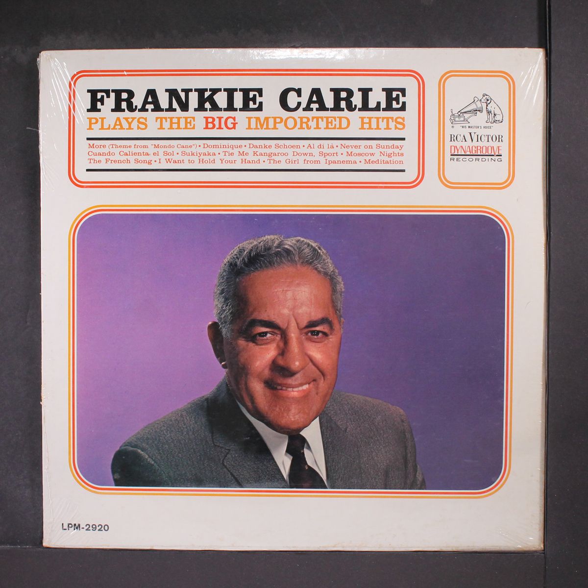 plays the big imported hits by FRANKIE CARLE