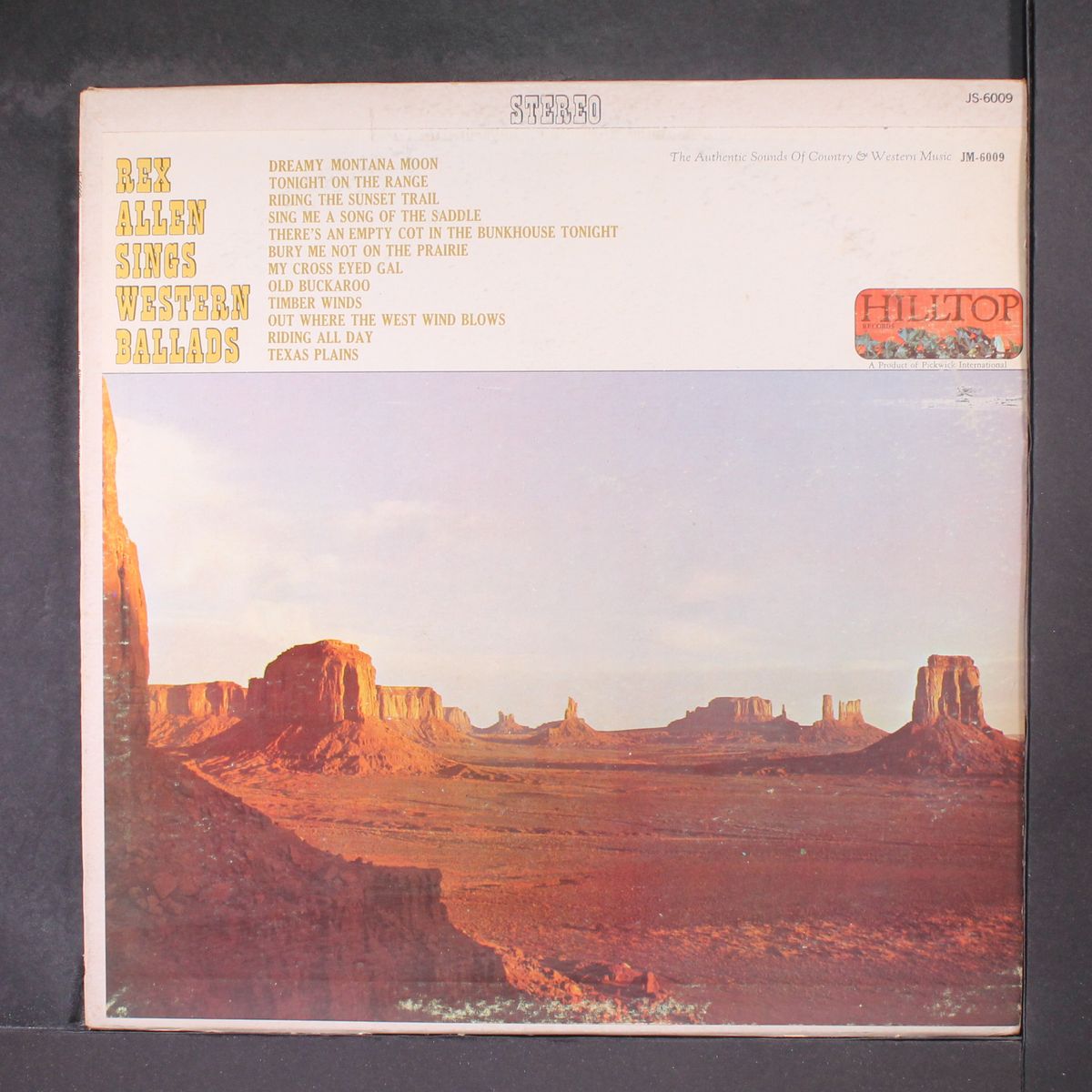sings western ballads by REX ALLEN