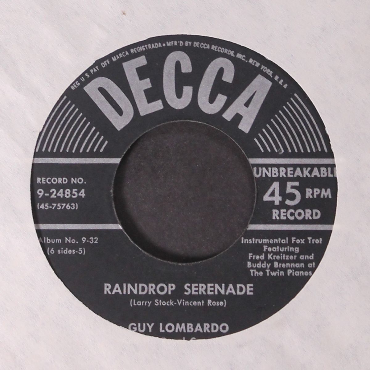 la golondrina / raindrop serenade by GUY LOMBARDO