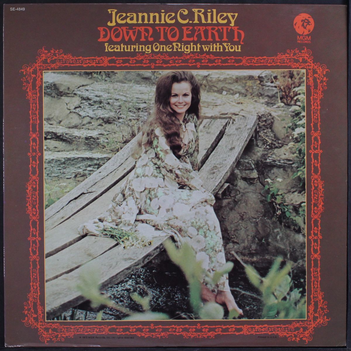 down to earth by JEANNIE C. RILEY