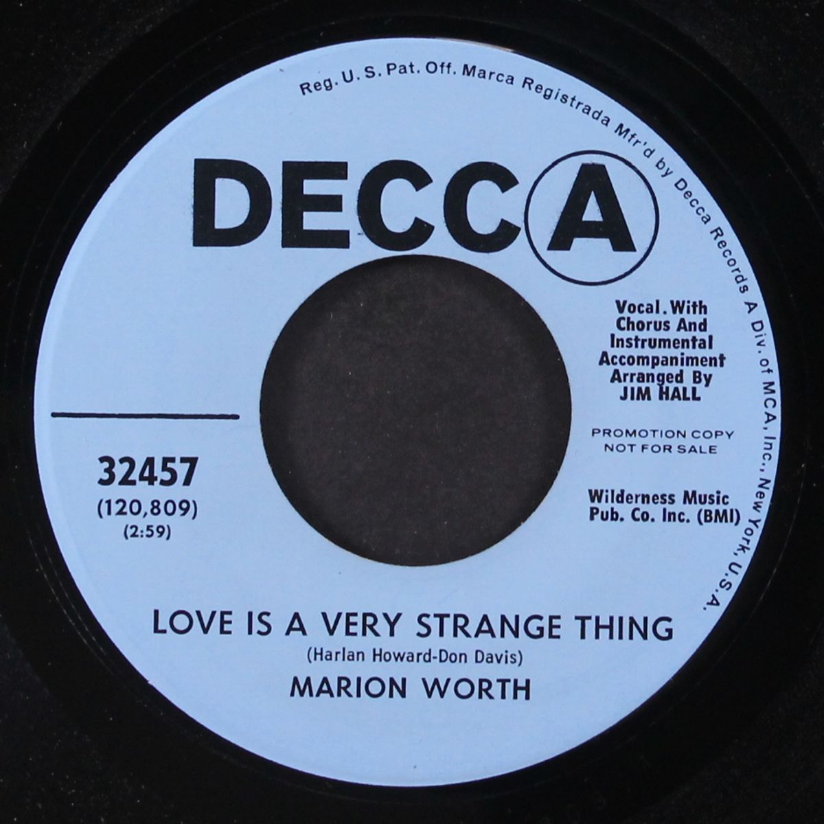 love is a very strange thing / wondering what to do by MARION WORTH