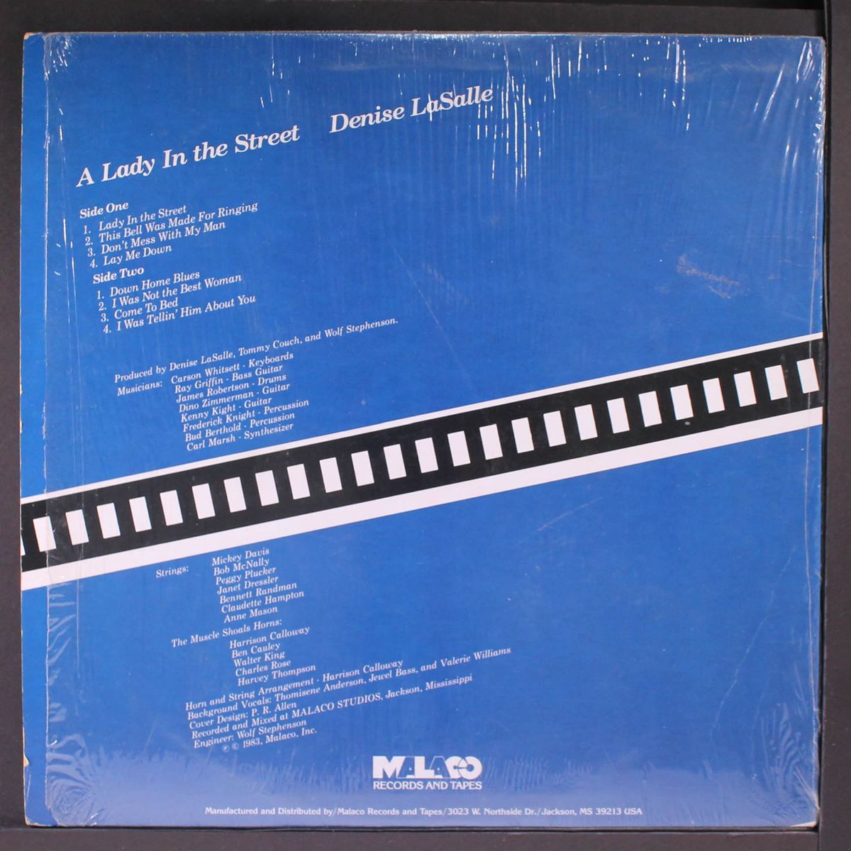 a lady in the street by DENISE LA SALLE