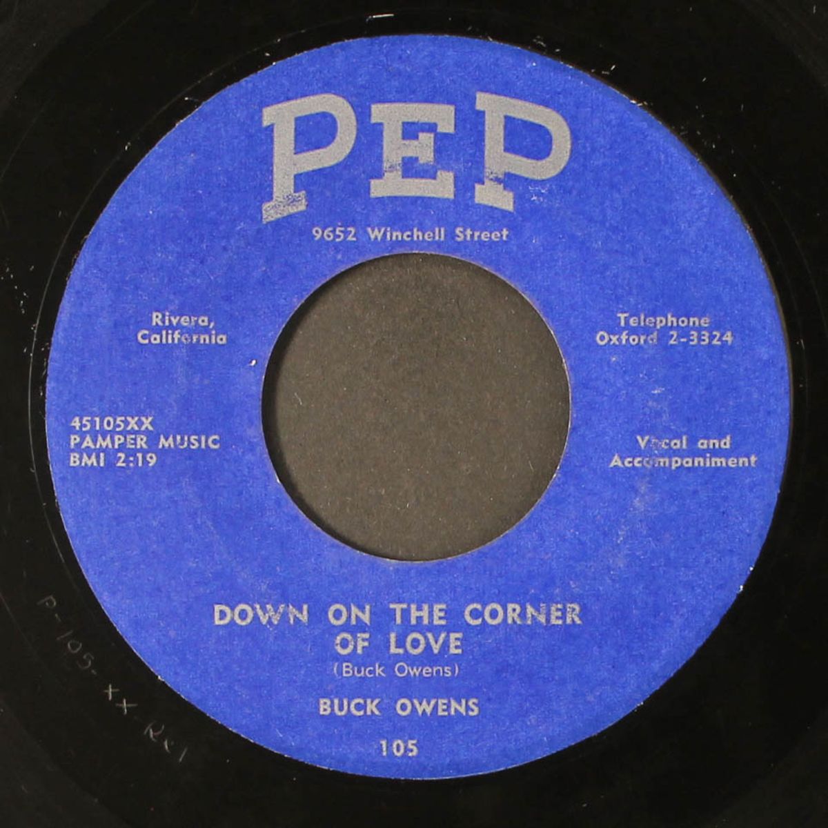it don't show on me / down on the corner of love by BUCK OWENS