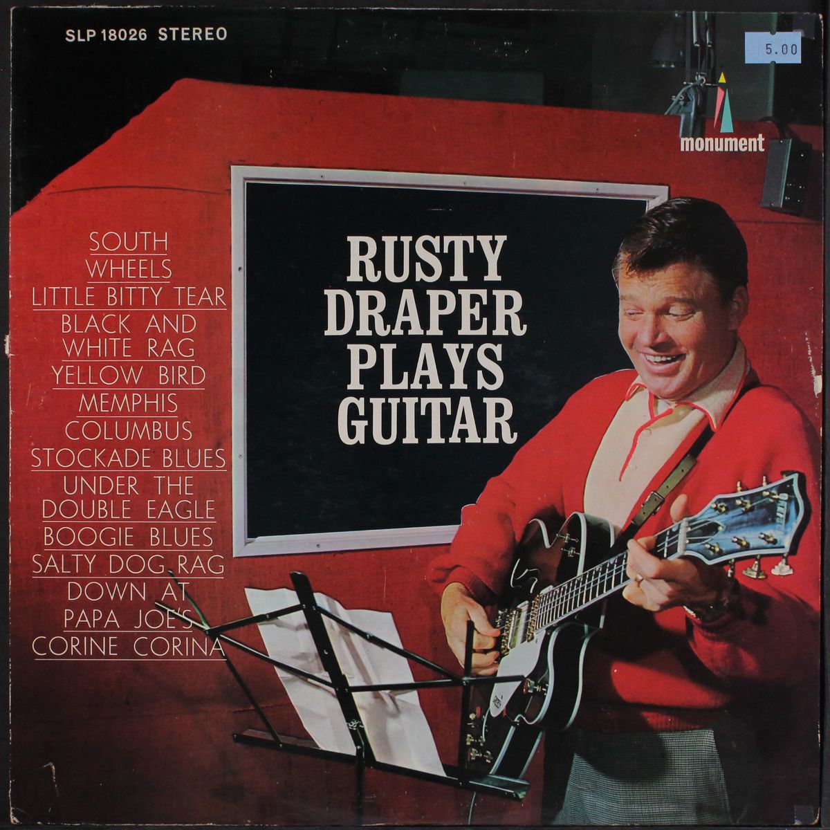 plays guitar by RUSTY DRAPER