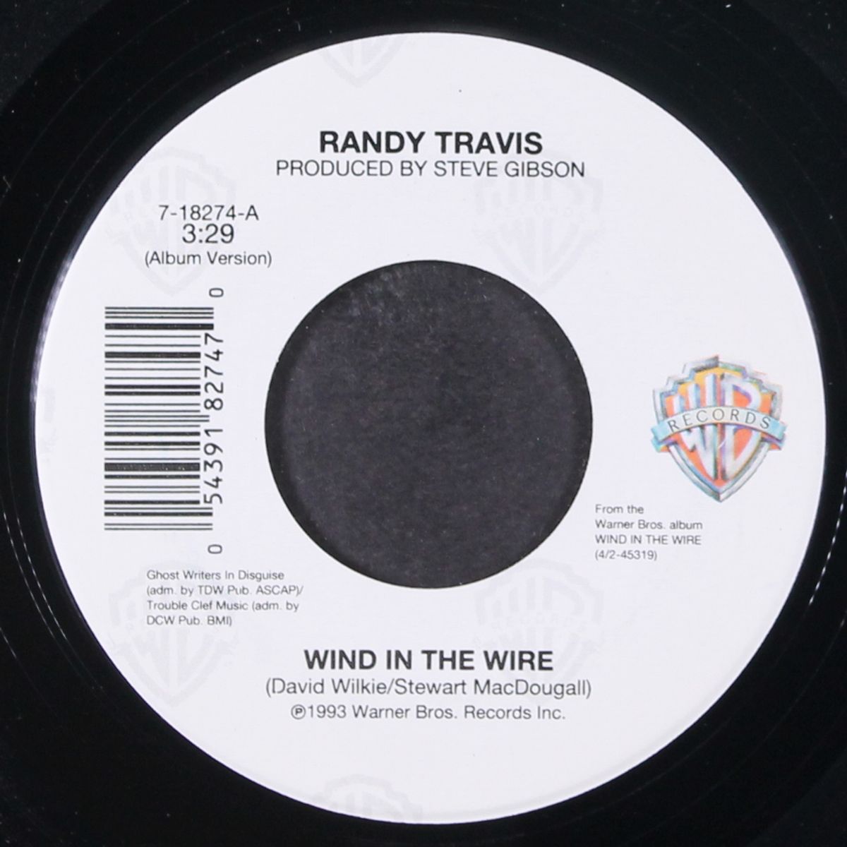 wind in the wire / down at the old corral by RANDY TRAVIS