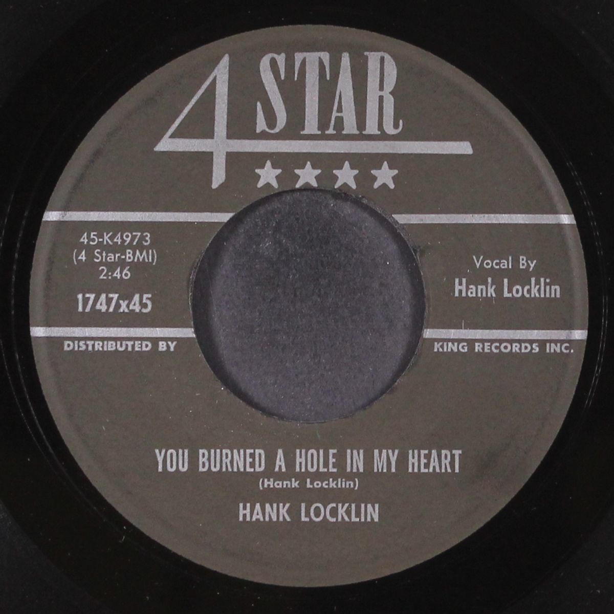 you burned a hole in my heart by HANK LOCKLIN