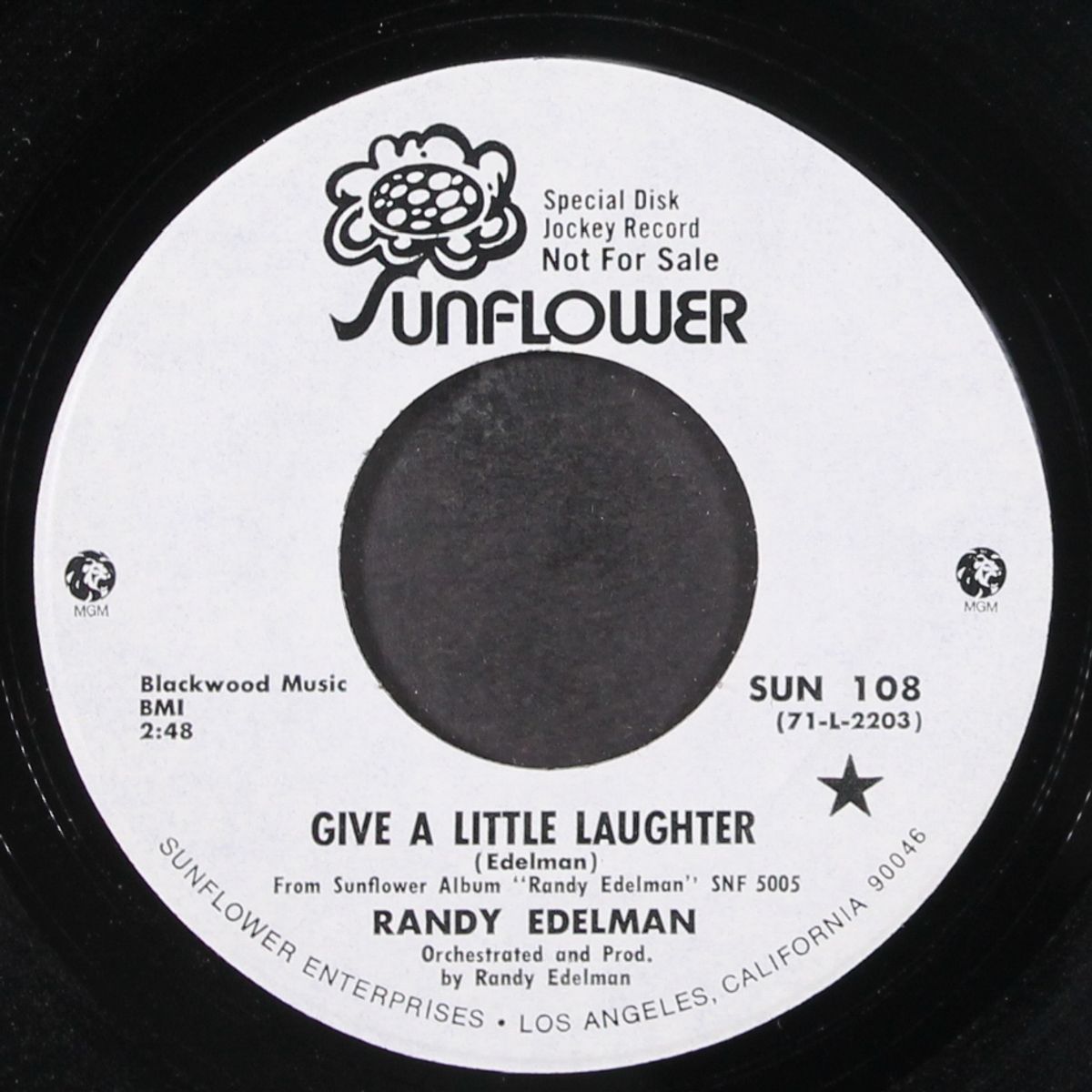 give a little laughter by RANDY EDELMAN