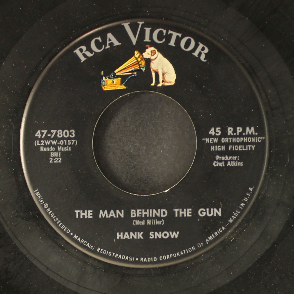 the man behind the gun by HANK SNOW