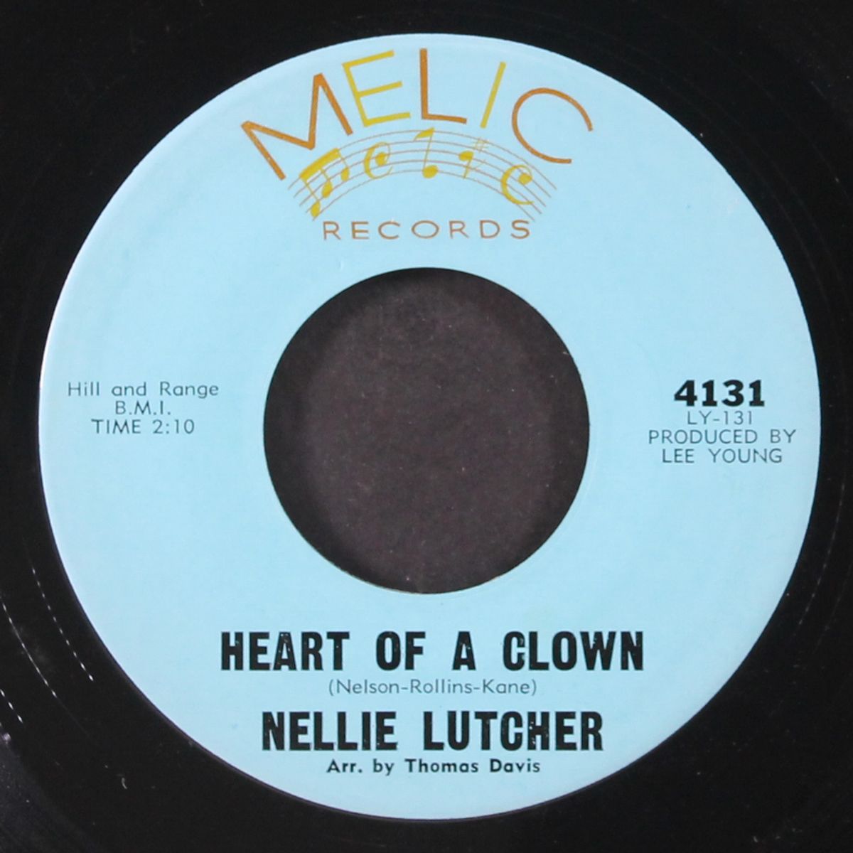 reaching for the moon / heart of a clown by NELLIE LUTCHER