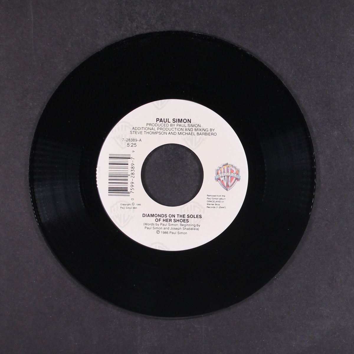 diamonds on the soles of her shoes / all around the world or the myth by PAUL SIMON