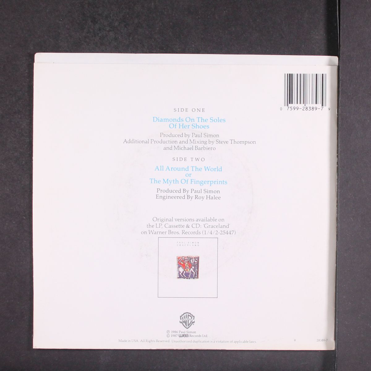 diamonds on the soles of her shoes / all around the world or the myth by PAUL SIMON