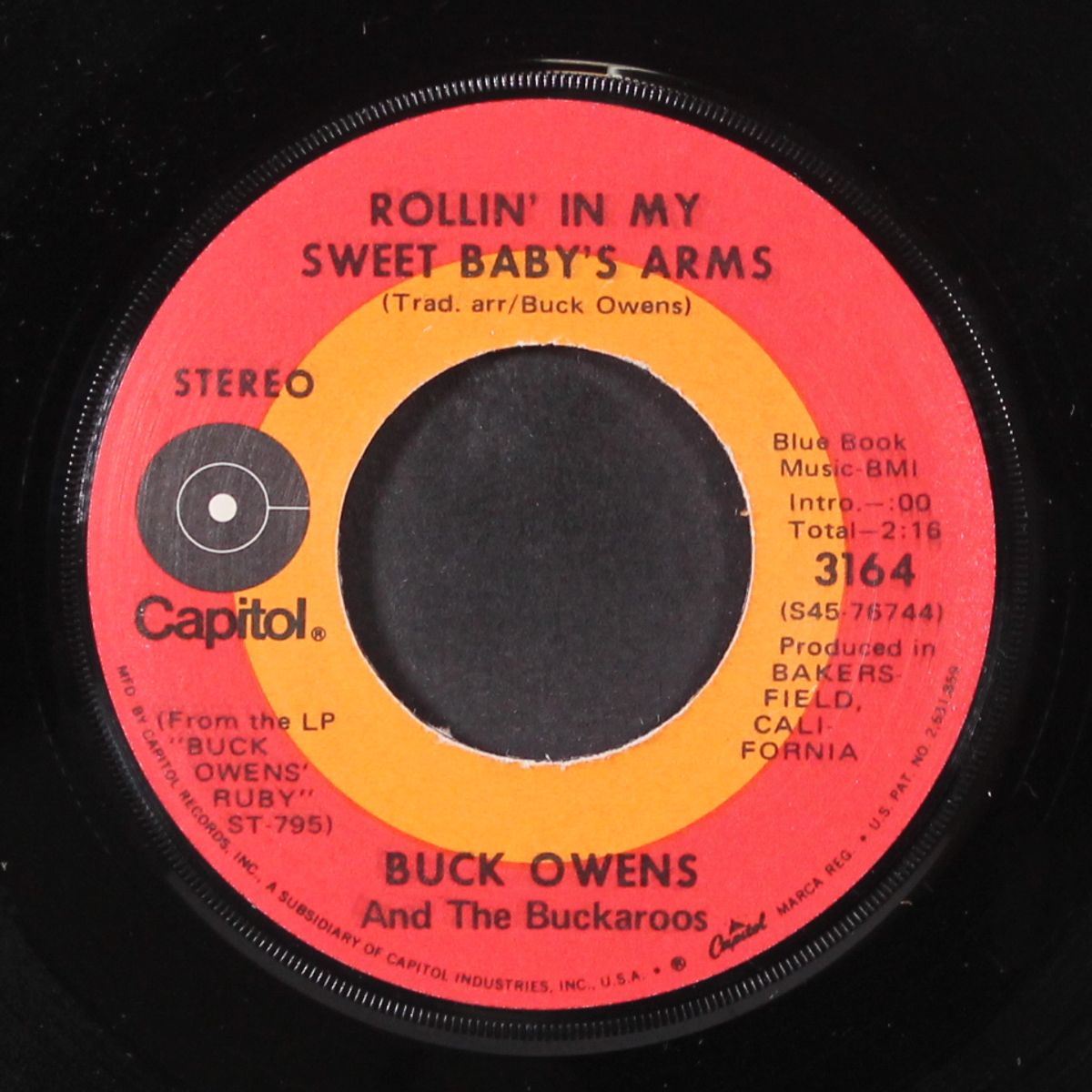 rollin' in my sweet baby's arms / corn likker by BUCK OWENS
