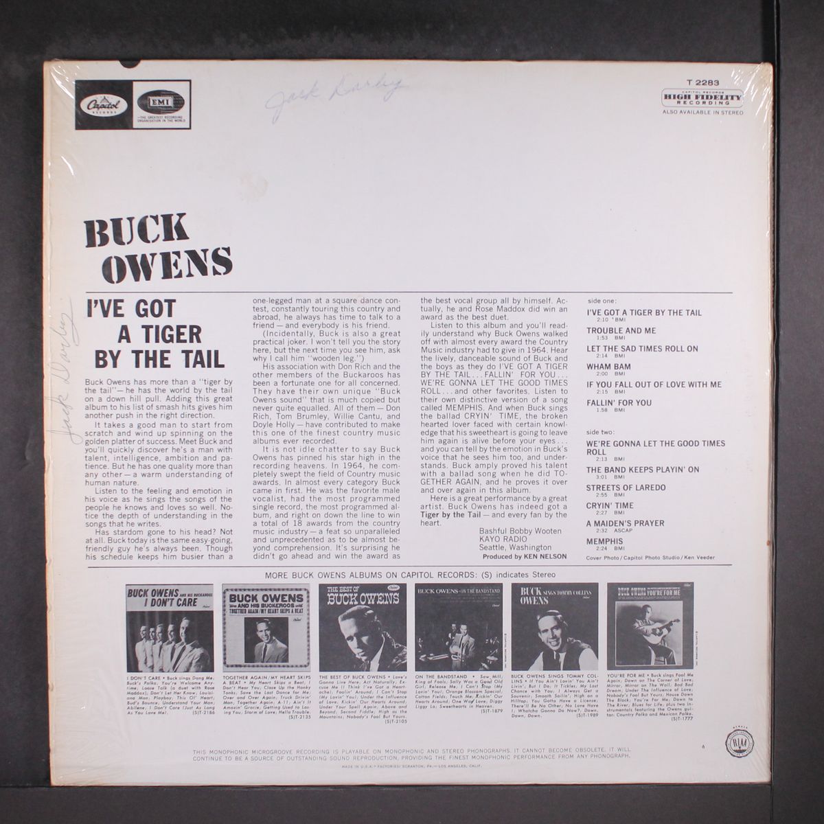 i've got a tiger by the tail by BUCK OWENS
