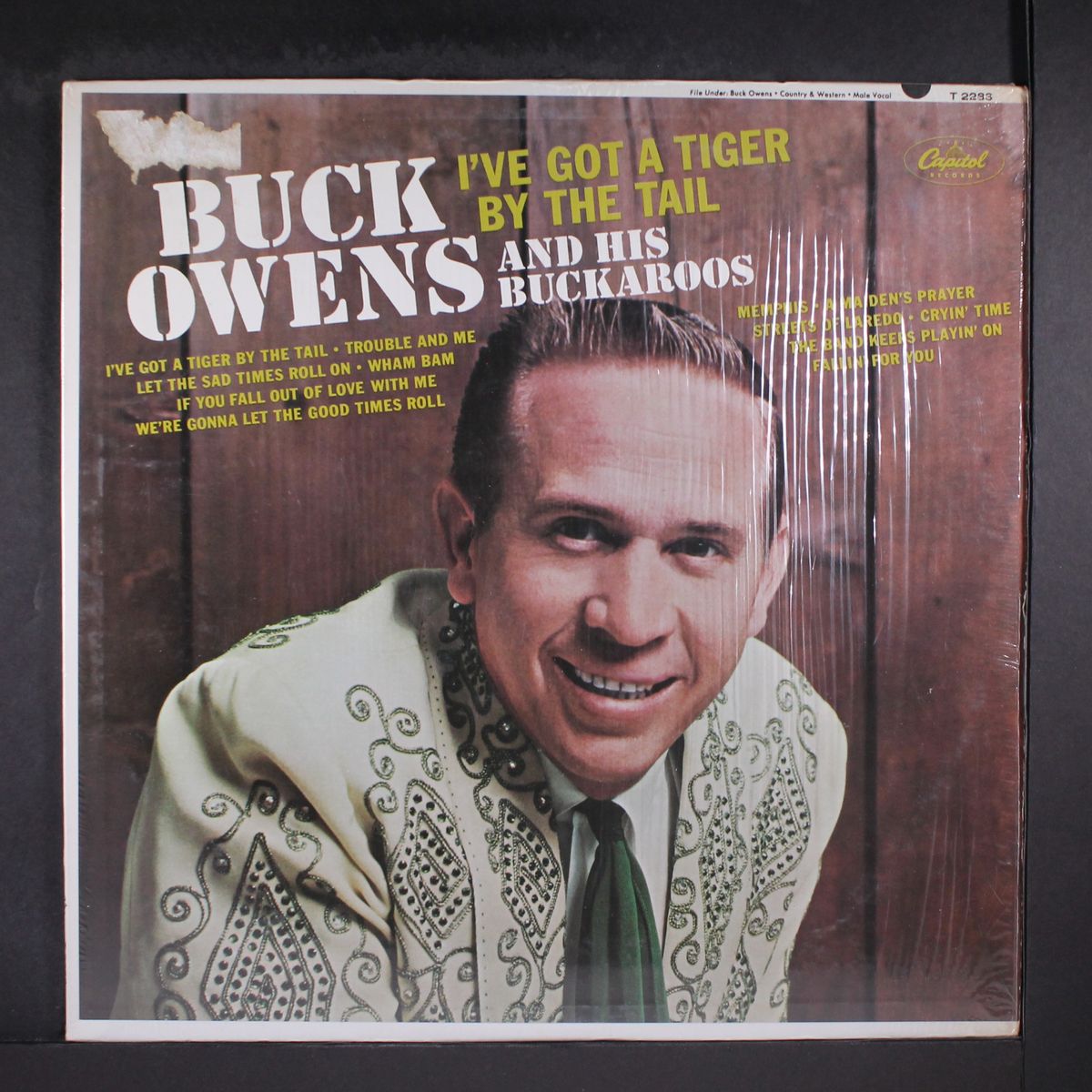i've got a tiger by the tail by BUCK OWENS