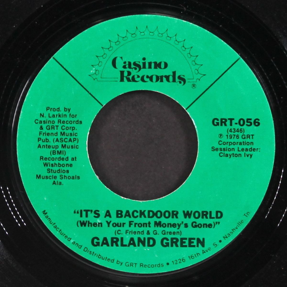 i.o.u. / it's a backdoor world by GARLAND GREEN