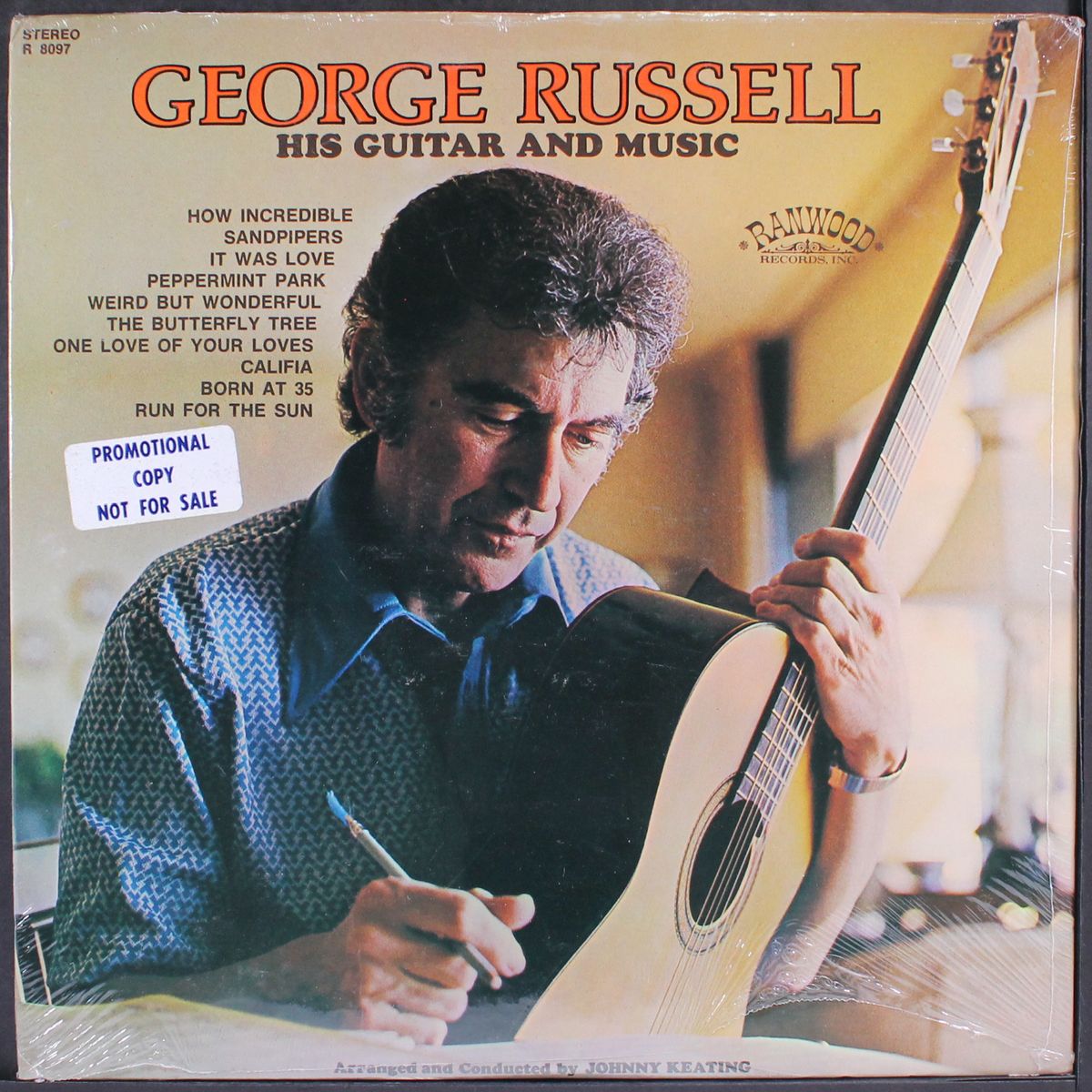 his guitar and music by GEORGE RUSSELL