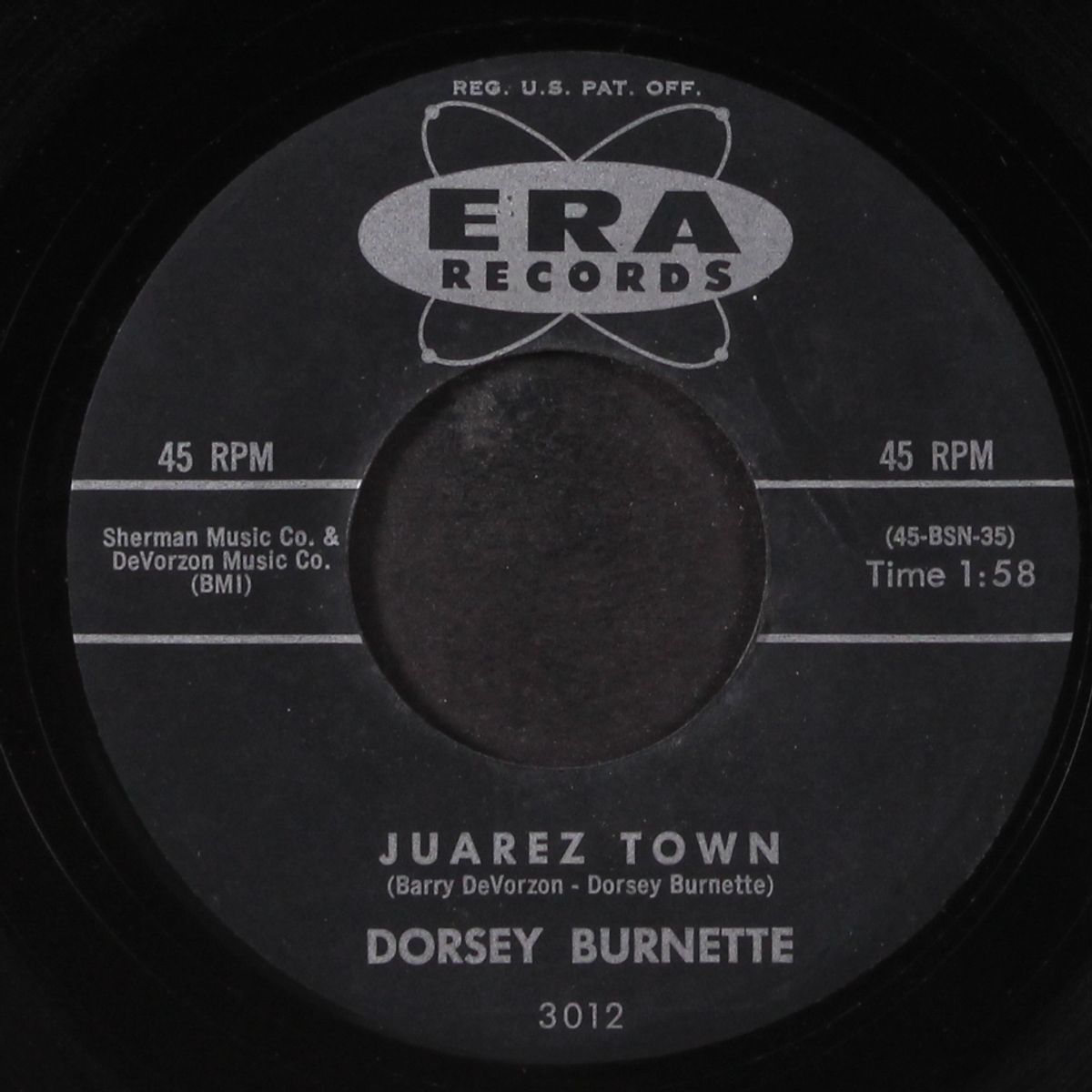 tall oak tree / juarez town by DORSEY BURNETTE