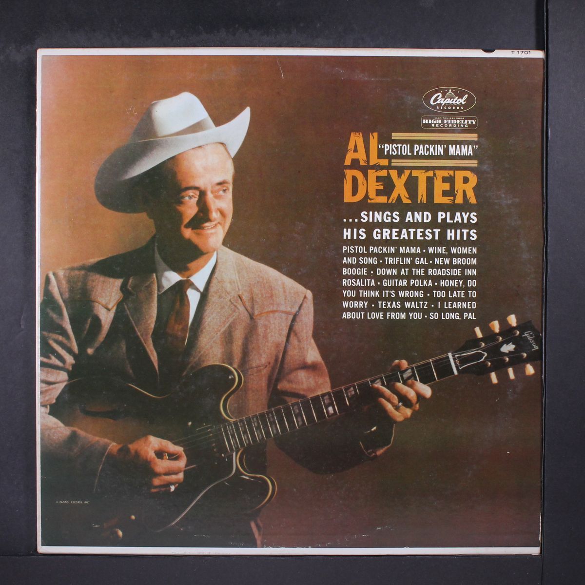 sings and plays his greatest hits by AL DEXTER