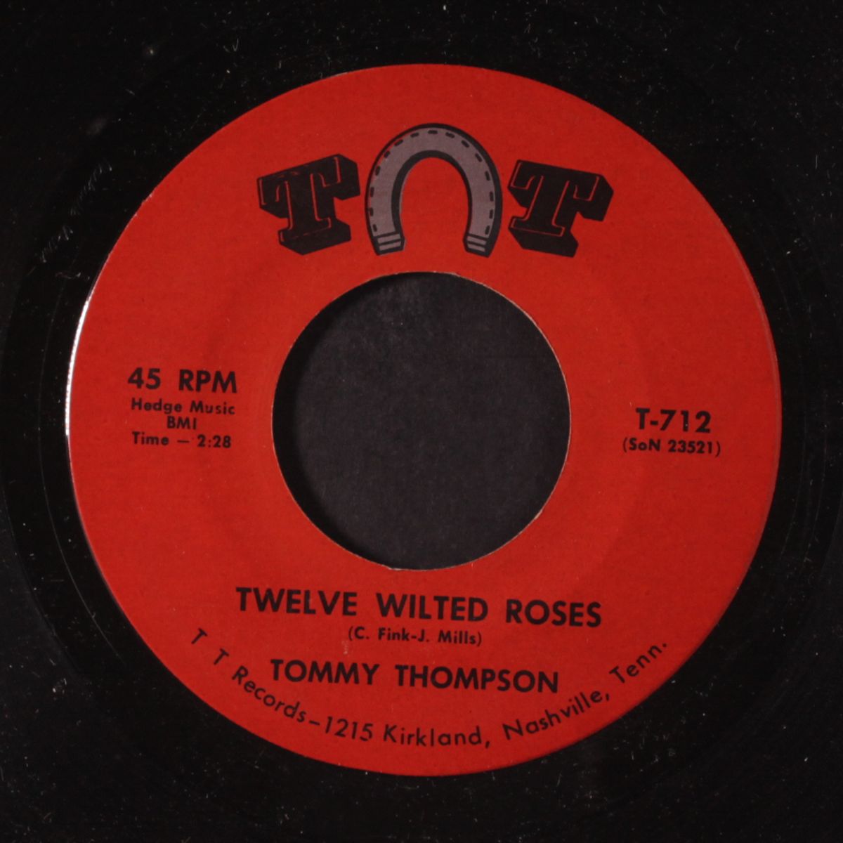 twelve wilted roses by TOMMY THOMPSON