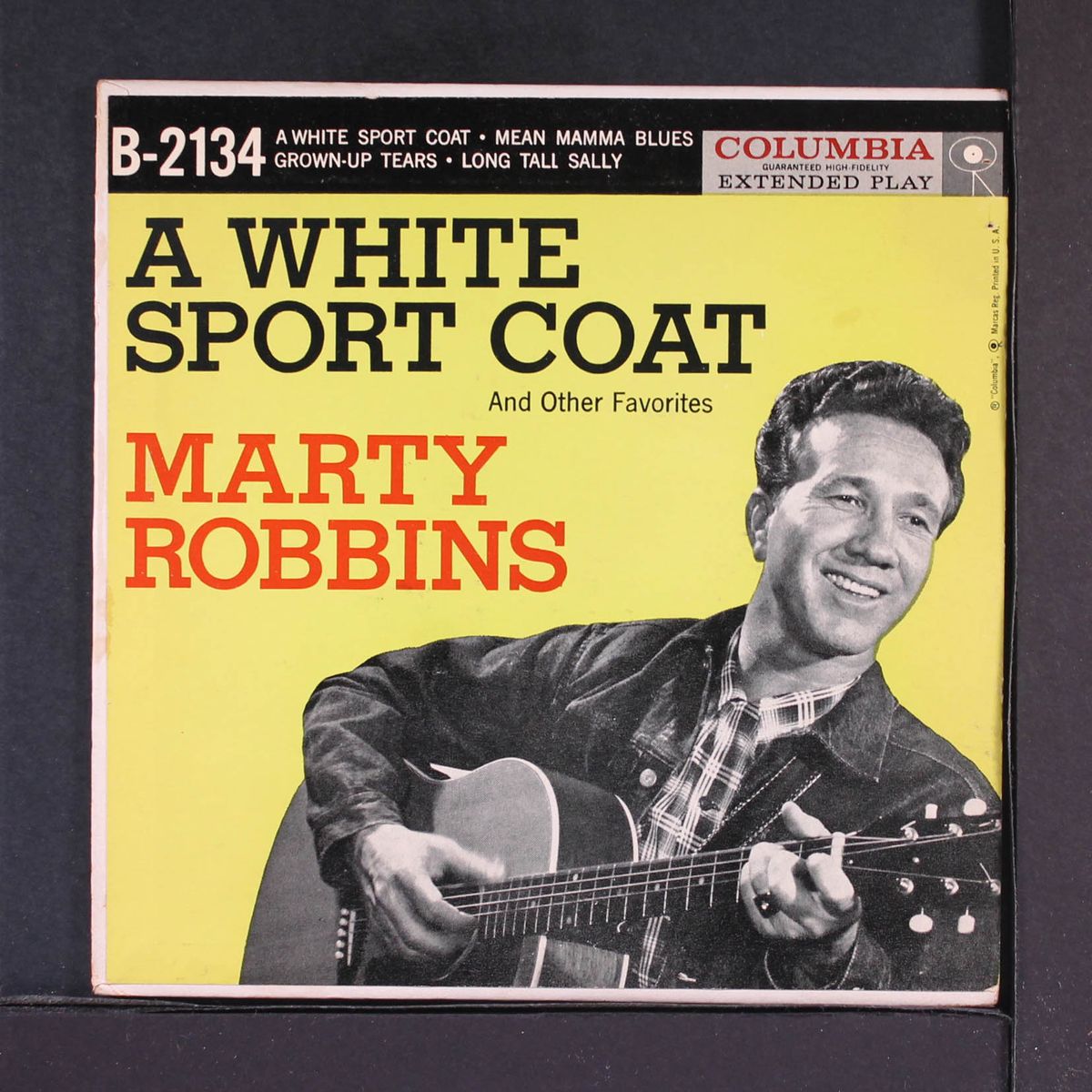 a white sport coat by MARTY ROBBINS