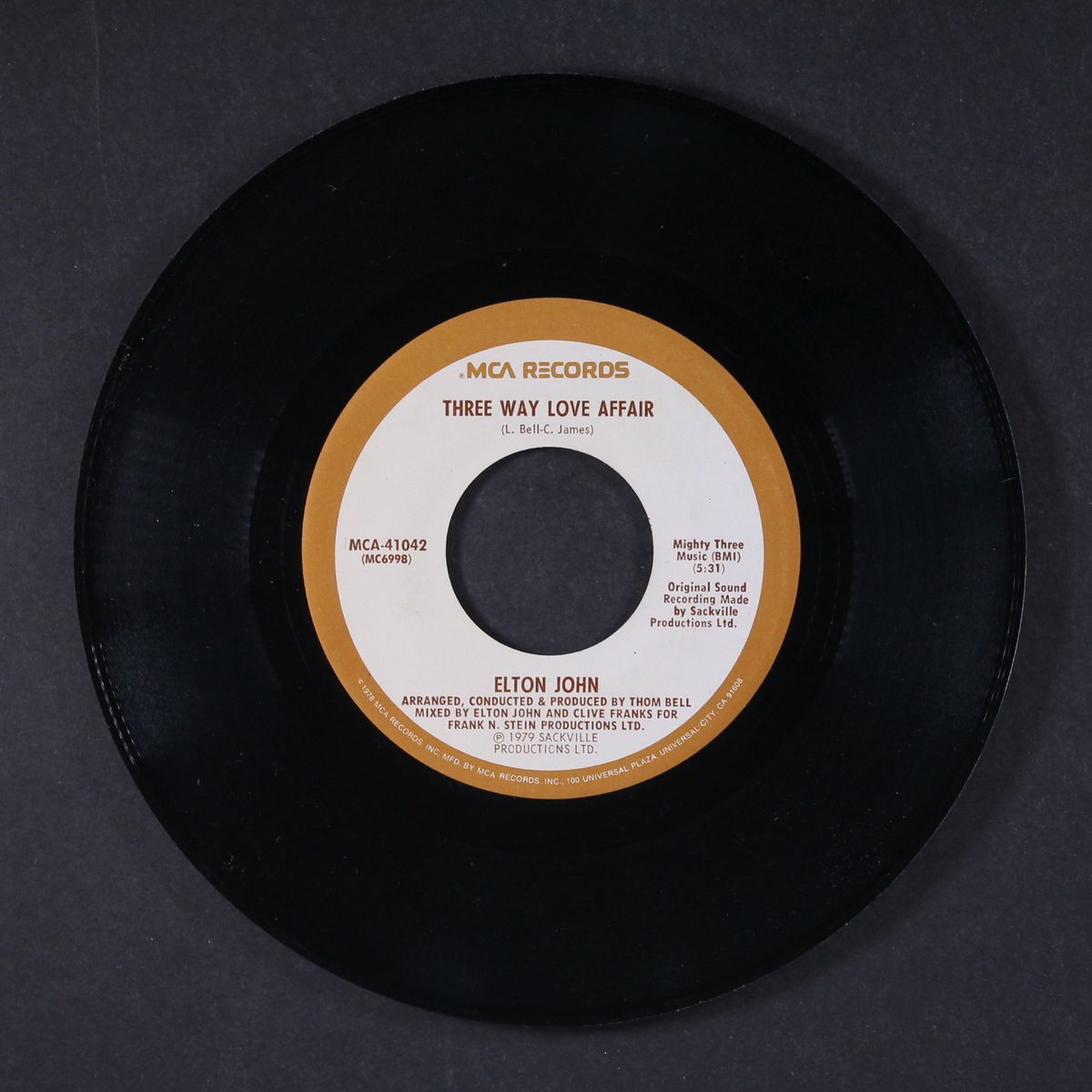 mama can't buy you love / three way love affair by ELTON JOHN