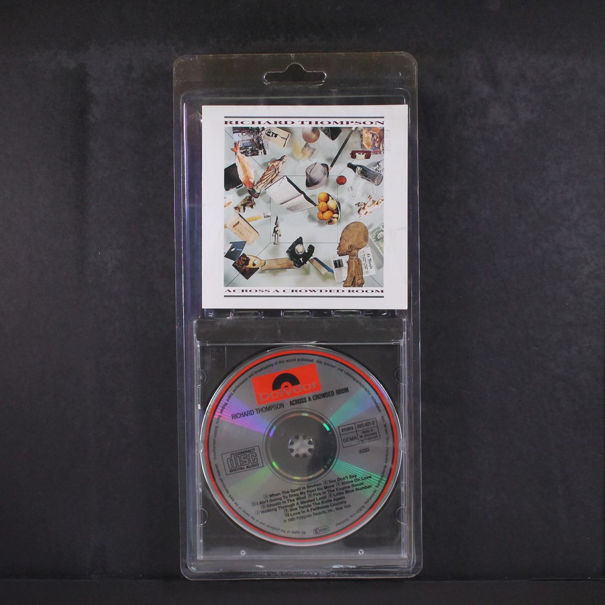 across a crowded room by RICHARD THOMPSON