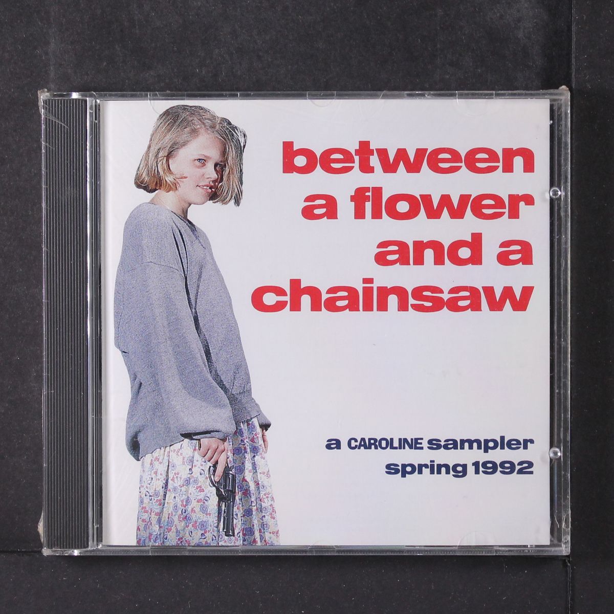 between a flower and a chainsaw by VARIOUS
