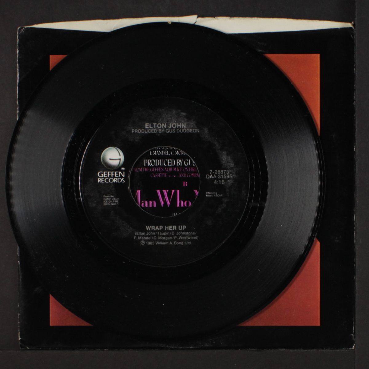wrap her up / the man who never died by ELTON JOHN