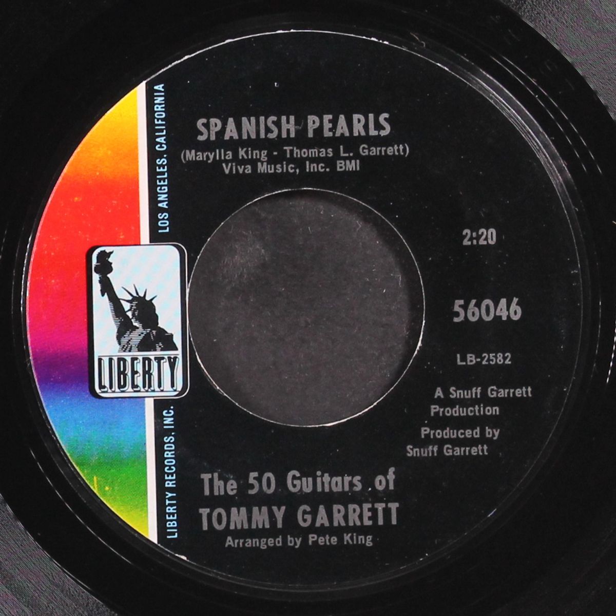 hang 'em high / spanish pearls by TOMMY GARRETT