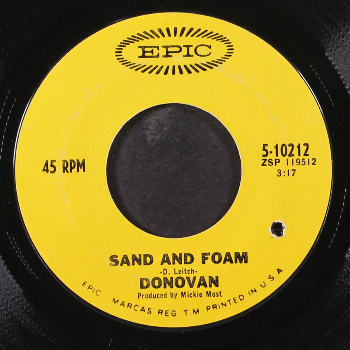 there is a mountain / sand and foam by DONOVAN