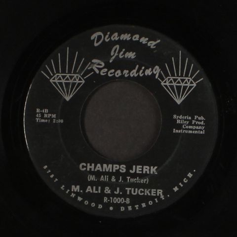 M. ALI & J. TUCKER