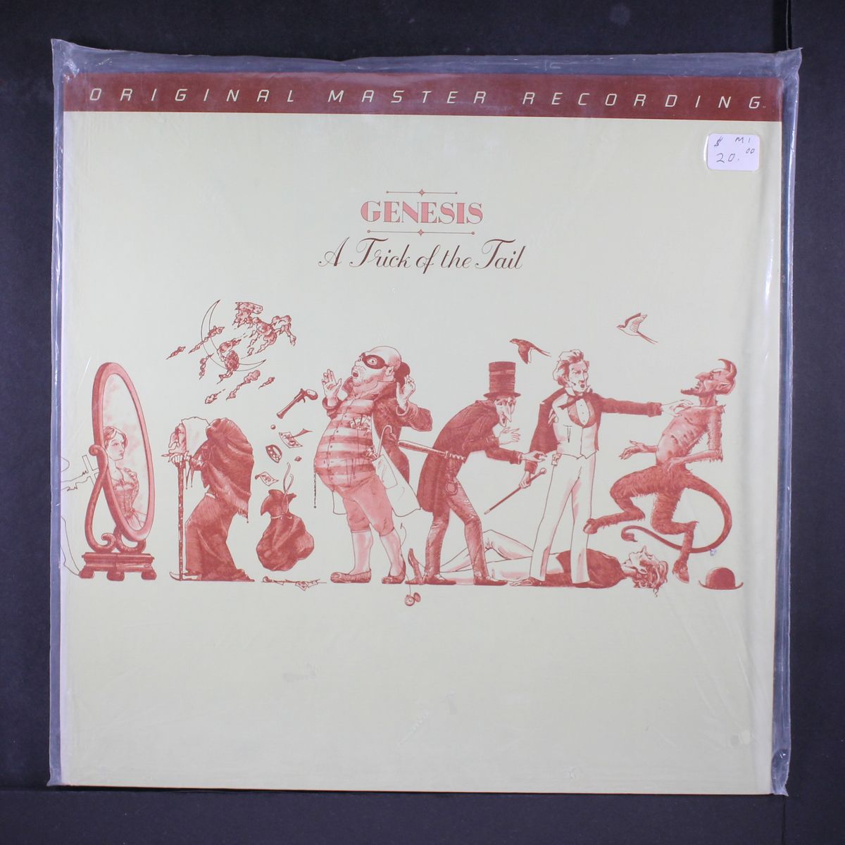 a trick of the tail by GENESIS